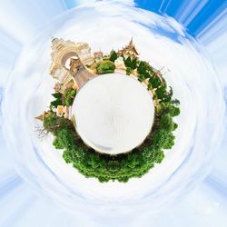 Little planet effect of temple building against sky