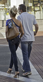 Young man standing in parking lot