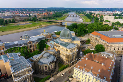 High angle view of buildings in city by river