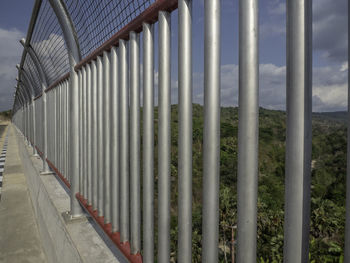 Metal fence by railing