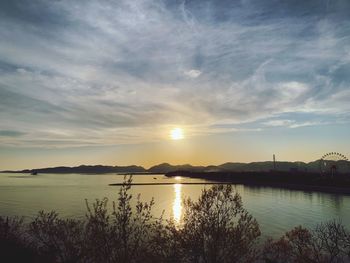 Scenic view of lake against sky during sunset