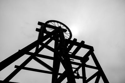 Low angle view of ferris wheel against sky