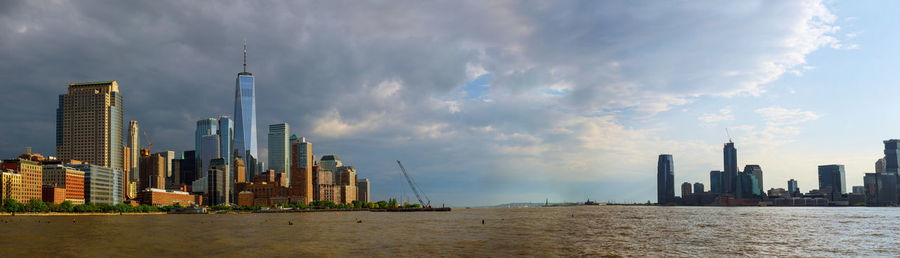 Panoramic view of city buildings against sky