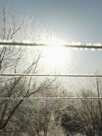 Scenic view of snow covered land against sky