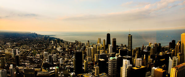 Panoramic view of modern buildings against sky during sunset