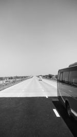 Car on road against clear sky