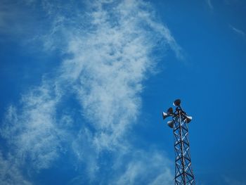 Low angle view of crane against sky