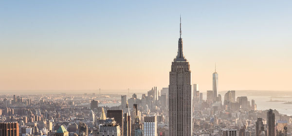 Modern buildings in city against sky