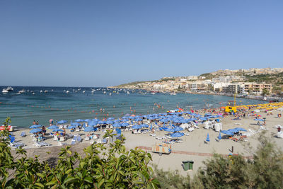 Scenic view of sea against clear blue sky