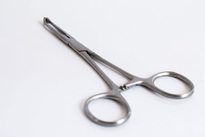 Close-up of scissors against white background