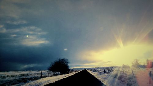 Scenic view of landscape against sky at night during winter