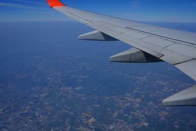 Aerial view of airplane flying over landscape