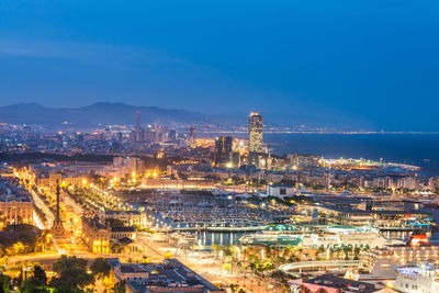 High angle view of illuminated city buildings at night