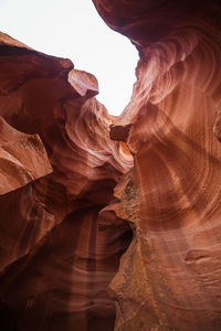 Close-up of rock formation against sky