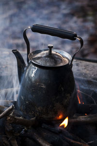 Close-up of a kettle on chulah