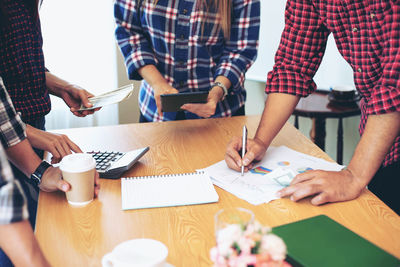 Group of people working on table