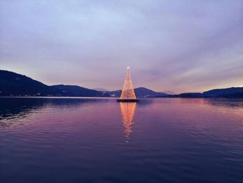 Sailboat in sea against sky