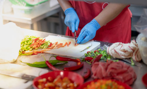 Midsection of man preparing food