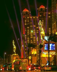 Illuminated buildings in city at night