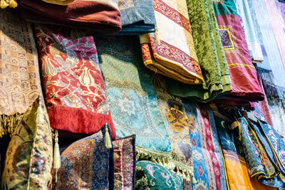 Low angle view of multi colored umbrellas hanging at market stall