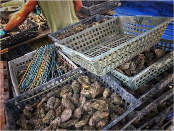 High angle view of man preparing food in basket