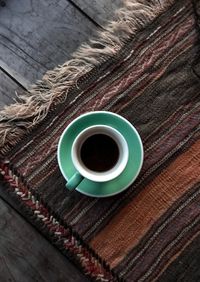 High angle view of coffee cup on table
