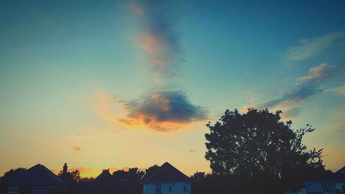 High section of building against sky at sunset