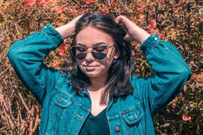 Portrait of young woman wearing sunglasses