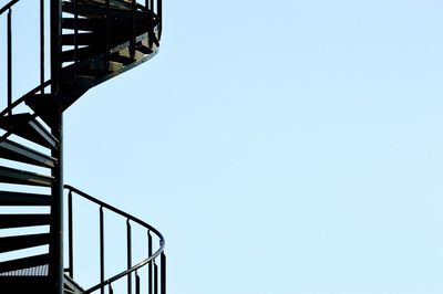 Low angle view of spiral staircase against clear sky