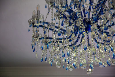 Low angle view of chandelier hanging on ceiling