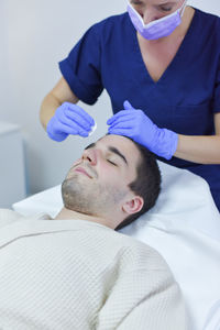 Low section of man lying on floor