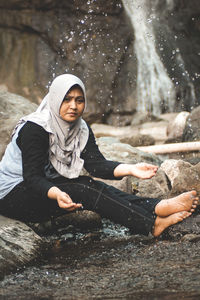 Full length of young woman in water