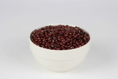 Close-up of coffee beans against white background