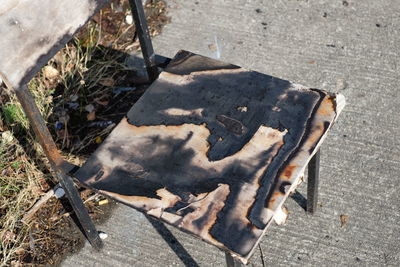 High angle view of burnt chair