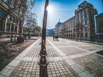 Street amidst buildings in city against sky