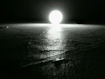 Close-up of illuminated sun at sunset