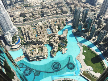 High angle view of swimming pool against buildings in city