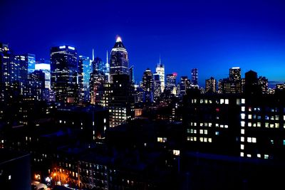 Illuminated buildings in city at night