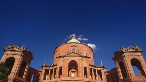 Low angle view of historical building against blue sky