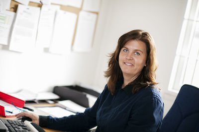 Smiling woman in office