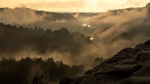 Scenic view of mountains against sky during sunset