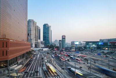 High angle view of city street and buildings against sky