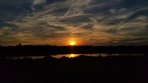 Scenic view of silhouette landscape against sky during sunset