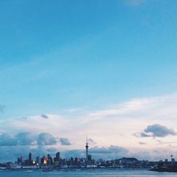 City skyline against blue sky