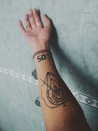 Close-up of woman hand with text