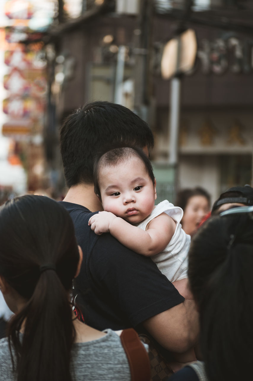 child, childhood, real people, men, males, boys, portrait, lifestyles, leisure activity, togetherness, women, family, people, incidental people, females, focus on foreground, bonding, innocence, group of people, son