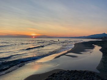 Scenic view of sea against sky during sunset