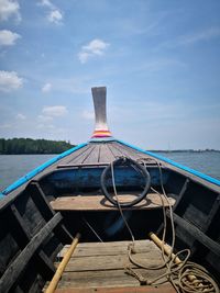 Ship moored on sea against sky