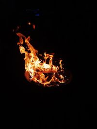 Close-up of fire in dark room