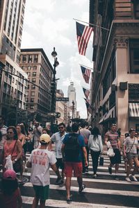 People walking on street in city